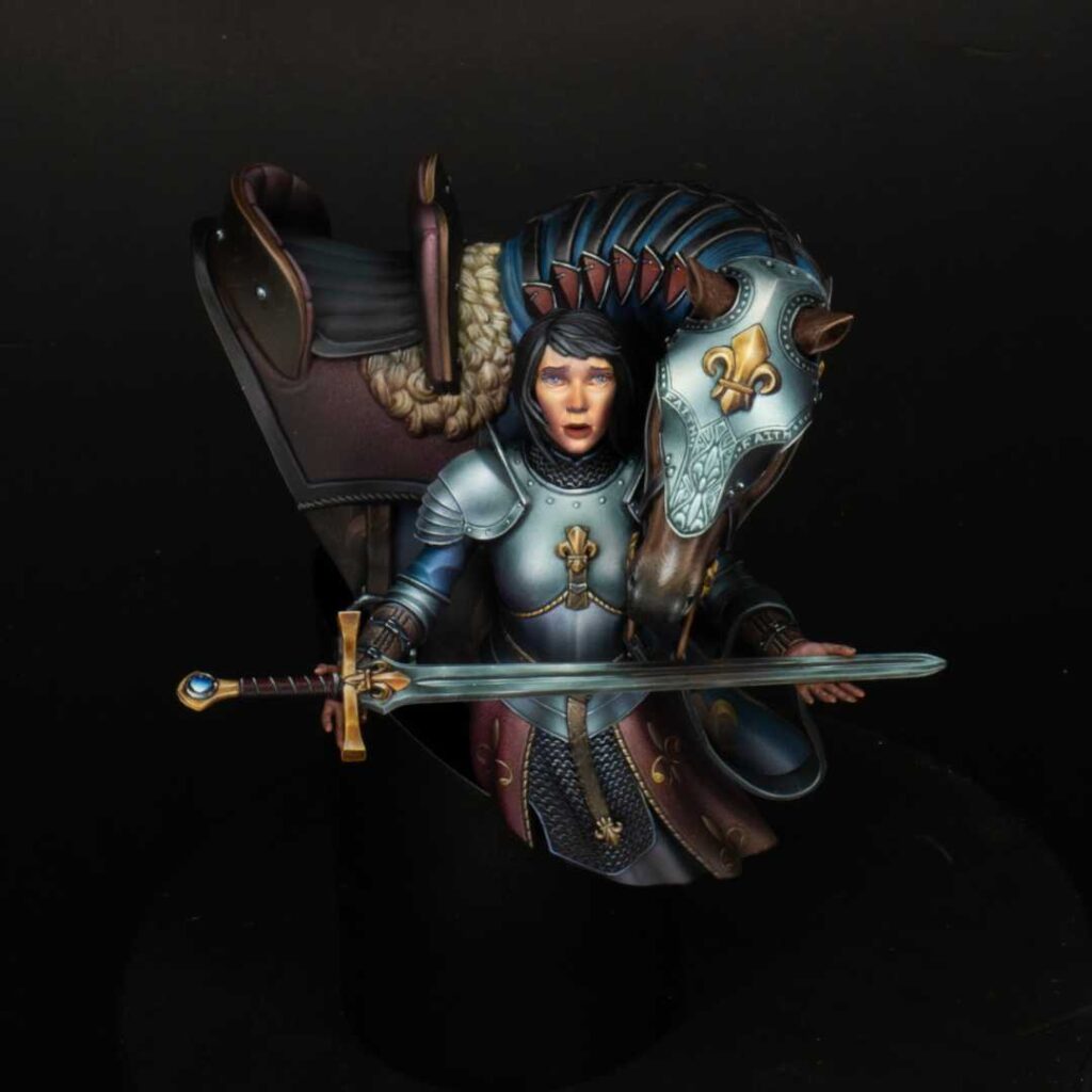A Repanse de Lyonesse figurine representing a female knight holding a sword, painted by Liam Hearne.